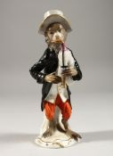 A GOOD 19TH CENTURY FURSTENBERG PORCELAIN MONKEY FIGURE playing a bagpipe. F mark in blue. 6ins