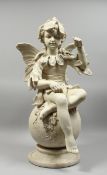 A POTTERY FIGURE OF A FAIRY on a circular base, 32 in. high.