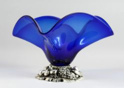 A BLUE LARGE GLASS SQUARED CENTREPIECE on a silvered base, 13 in.