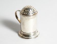 A QUEEN ANNE DRUM PEPPER with scroll handle, London 1712, maker, William Fleming.