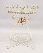 A WHITE PAINTED WIRE CIRCULAR PLANT STAND. 2ft 4ins high x 2ft diameter.