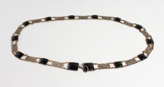 A LONG ISLAMIC FILIGREE AND CUT STONE NECKLACE, 34 inches long.
