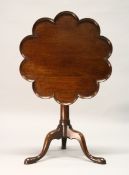 A GOOD GEORGE III MAHOGANY TILT TOP TRIPOD TABLE, with a lobed, dished top, plain turned column