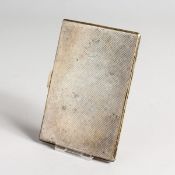 AN ENGINED TURNED SILVER CIGARETTE CASE complete with Player cigarettes Birmingham 1937