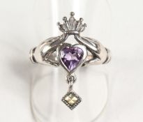 A SILVER AND CLADDAGH RING