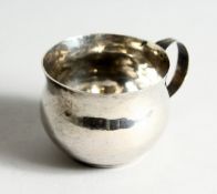 A SMALL QUEEN ANNE TOT CUP plain with scrolled handles, 2.25 ins diameter Engraved TW,. 1705.
