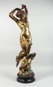 A TWO COLOUR GILDED BRONZE OF A STANDING NUDE with a cherub on a circular base, 3 ft. 3 in. high.