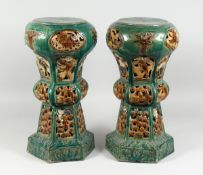 A PAIR OF CHINESE POTTERY GARDEN SEATS (one AF) 18 in. high.
