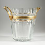 A VERY HEAVY BACCARAT OCTAGONAL TAPERING GLASS WINE COOLER with gilt mounts and handles, 9 ins