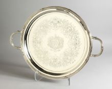 A SUPERB GEORGE III SILVER CIRCULAR TWO HANDLED TEA TRAY, with wooden base, reeded edge and engraved