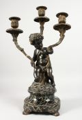 A GOOD 19TH CENTURY FRENCH BRONZE AND ORMOLU THREE BRANCH CANDELABRA formed as a cupid holding three