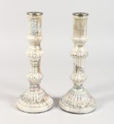 A PAIR OF VICTORIAN LUSTRE CANDLESTICKS 10 ins high.