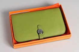 A GREEN LEATHER PURSE