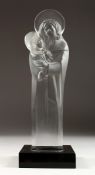 A LARGE LALIQUE CRYSTAL MADONNA AND CHILD, CIRCA 1950 on a black base. Signed, 13.5 ins high