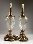 A PAIR OF CUT GLASS AND GILT ELECTRIC LAMP BASES. 19ins high.