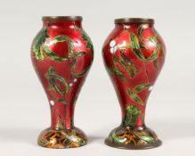 A SMALL PAIR OF 19TH CENTURY ENAMEL VASES. 4.5ins high.