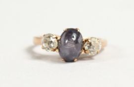 A STAR SAPPHIRE AND DIAMOND THREE STONE RING