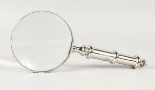 A CHROME MAGNIFYING GLASS