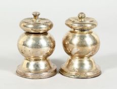 TWO SILVER PEPPER MILLS 3 inches high, 1927 & 1934.
