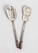 TWO CONTINENTAL SILVER SPOONS with pierced bowls, 6 inches long.