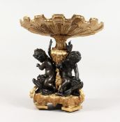 A GOOD GILT AND BRONZE CENTREPIECE, three cupids holding a shell. 12 ins high.