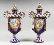 A SUPERB LARGE PAIR OF SEVRES TWO HANDLED VASES AND COVERS, rich blue and white ground edged in gilt