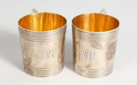A SMALL PAIR OF GEORGE II SILVER MUGS, 2.75 ins, 2.75 is high London 1792