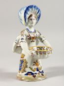 A DELFT DOUBLE SIDED SALT a young girl carrying two baskets 6 ins high.