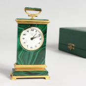 A LOOPING MALACHITE AND METAL CLOCK, 4 inches high in a fitted case.