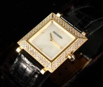 A VERY GOOD BOUCHERON 18CT GOLD DIAMOND SET WRISTWATCH with leather strap, No. AJ4103, in case