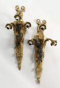 A PAIR OF CAST BRASS THREE BRANCH WALL APPLIQUES, with patinated brass figural mounts. 29.5 ins