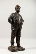 PAOLO TROUBETZKOY (1866-1938) RUSSIAN A CAST BRONZE OF A MAN STANDING HANDS ON HIPS, smoking a