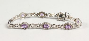 A SILVER AMETHYST AND CZ BRACELET.