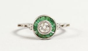 A PLATINUM DIAMOND AND EMERALD DECO RING
