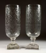 A GOOD PAIR OF ENGRAVED STORM LAMPS on square bases 15 ins high
