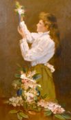19th/ 20th century school, A study of a young lady arranging flowers, oil on canvas, 24