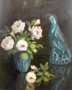 Raymond Tassoul (b. 1887) French, A still life of flowers in a vase with ornaments, oil on board,