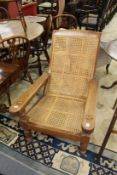 A teak plantation armchair.