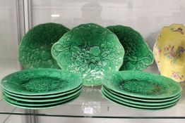 A quantity of green Majolica leaf moulded plates.