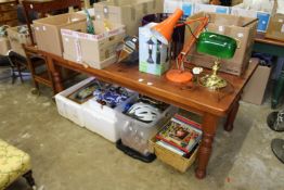 A large stained pine kitchen table.