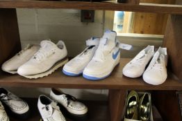 Three pairs of trainers to include Nike Airforce 1, size 9, appear unused.