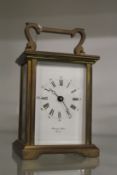 A brass carriage clock.