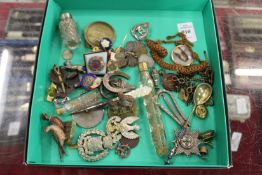 Various badges, scent bottles, collectable items.