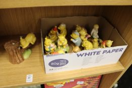 A good collection of Royal Doulton Winnie the Pooh porcelain ornaments and related items.