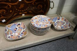 Eight Imari plates and a pair of matching dishes.