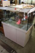 A Juwel large aquarium fish tank on stand with accessories.