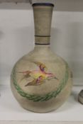 An unusual pottery hookah base or vase painted with flowers.