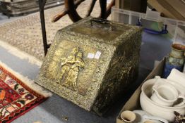 An embossed brass coal box.