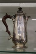 A silver hot water jug.