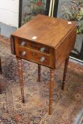 A 19th century mahogany two drawer drop flap work table.